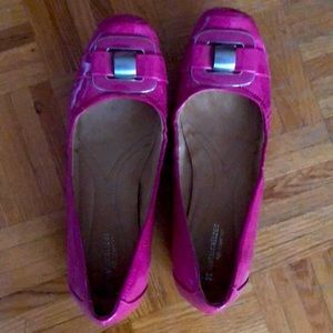 Cute pair of pink flats. Size 9.  Patent like material. Good condition